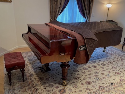 Bosendorfer with quilted cover. from Front Left