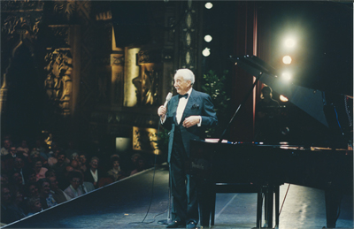 Victor Borge alongside an Imperial Bosendorfer piano