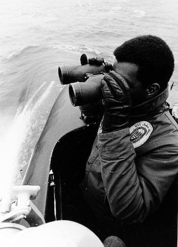 Seaman Daniel J. Lewis stands watch with Hayward U.S. Navy Mark 45 binocular aboard U.S.S. Joins Adams (SSBN-620), December 69, USN photo #1142945 (35,073 bytes)
