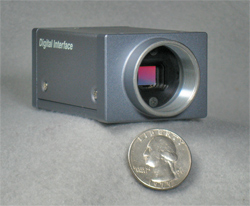 CCD camera with quarter for scale (31,561 bytes)